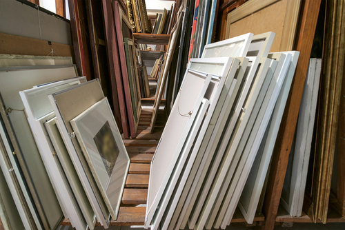 Wooden,shelves,at,art,gallery,storage,full,of,pictures,and